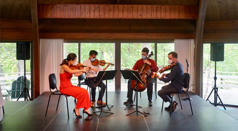 String quartet playing on a stage